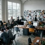 Bright open-plan PR agency Los Angeles studio with west-facing windows and a blurred mood-board wall.